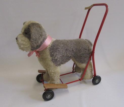 A Pedigree dog on wheels Image