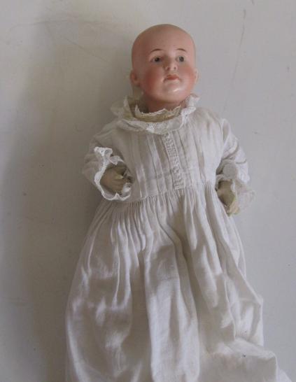 A Gebruder Heubach bisque head boy doll with intaglio eyes Image