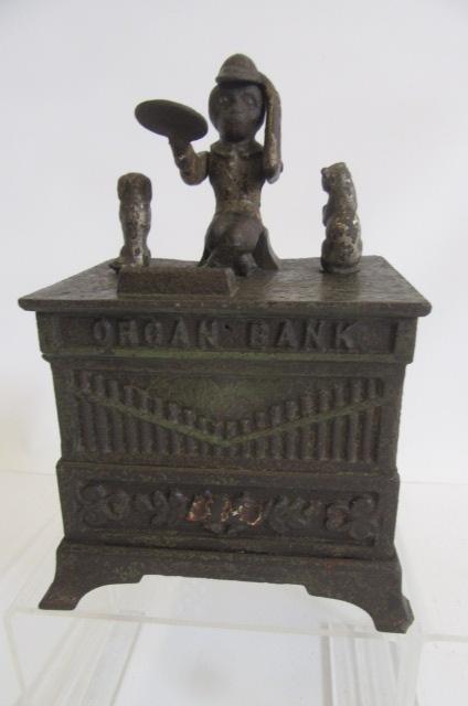 An American "Organ Bank" cast iron musical money box with animal surmounts Image