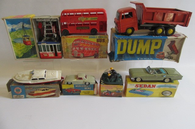 Nine boxed mainly friction drive tinplate and plastic toys and four unboxed (13) (Est. plus 21% Image
