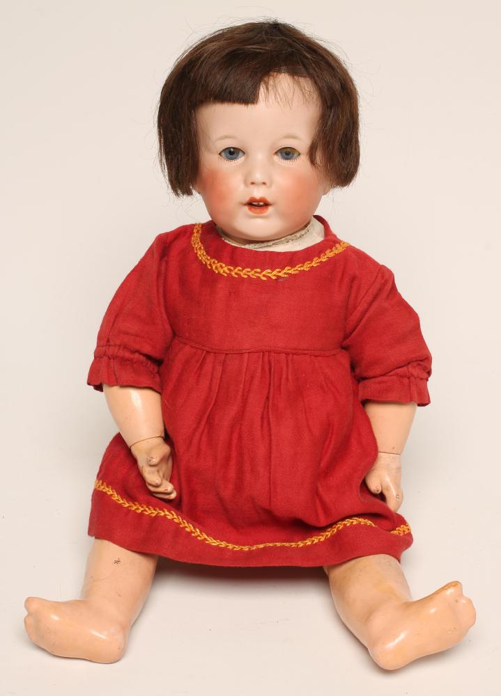 An S.F.B.J. bisque head character doll with blue glass sleeping eyes Image