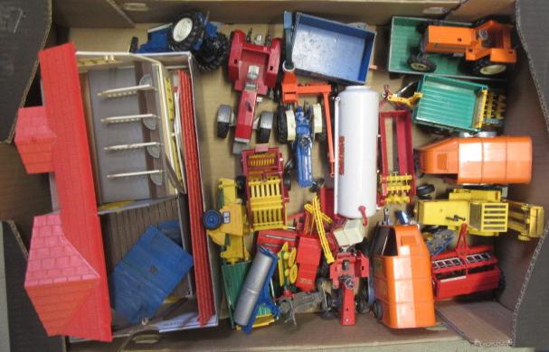 Approximately thirty Britains agricultural vehicles and equipment Image