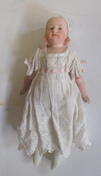 A Gebruder Heubach "Stuart Baby" shoulder head doll with intaglio eyes Image
