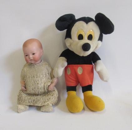 An Armand Marseille bisque head baby doll with brown glass sleeping eyes Image