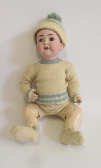 A Franz Schmidt & Co bisque head character boy doll with blue glass sleeping eyes Image