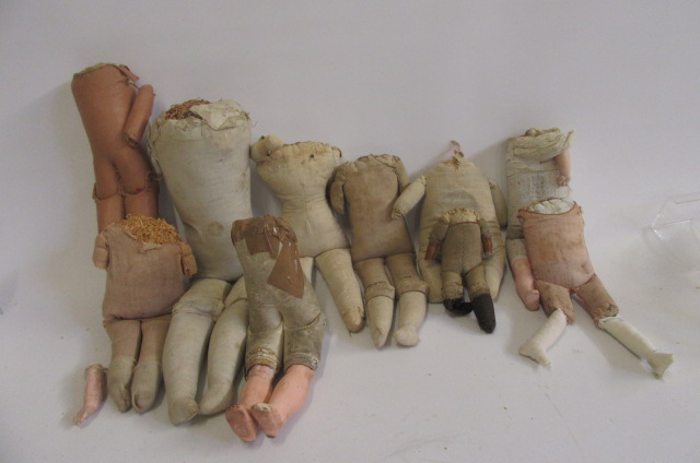 Ten various dolls' shoulder head bodies Image