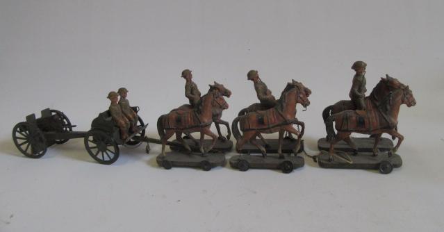 A horse-drawn field gun set comprising three pairs of composition horses with three riders in khaki Image