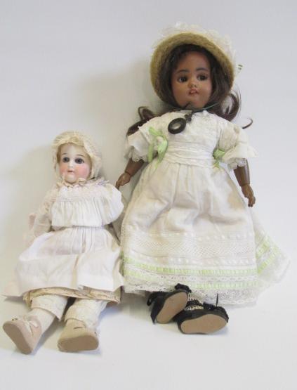 A Simon & Halbig mulatto doll with brown glass flirty eyes Image