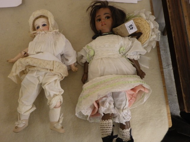 A Simon & Halbig mulatto doll with brown glass flirty eyes Image