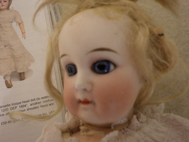 A Simon & Halbig mulatto doll with brown glass flirty eyes Image