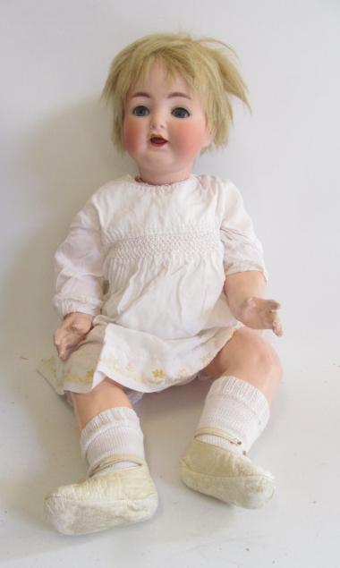 An Ernst Heubach bisque head character doll with blue glass sleeping eyes Image