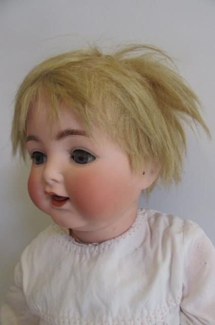 An Ernst Heubach bisque head character doll with blue glass sleeping eyes Image