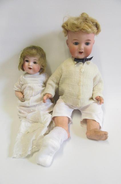 An Armand Marseille bisque head character doll with fixed blue glass eyes Image