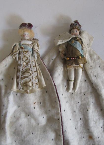 A pair of bisque shoulder head dolls house dolls dressed up as king and queen Image