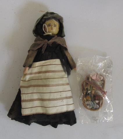 A painted wood pedlar doll with jointed limbs and original/contemporary clothes Image