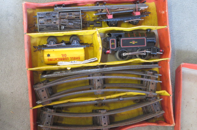 Playworn clockwork Type 41 tank locomotive and goods trucks Image