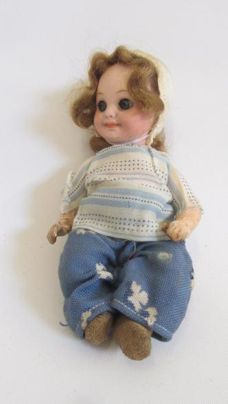 An Armand Marseille bisque head googly eyed doll Image