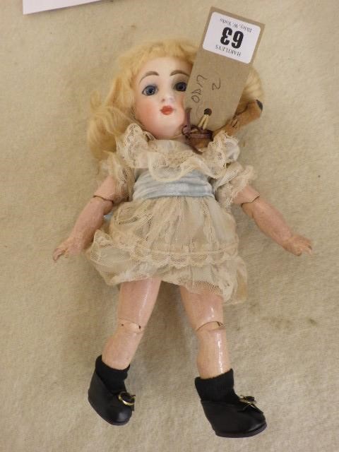 A Danel et Cie Paris-Bebe bisque head doll with fixed blue glass eyes Image