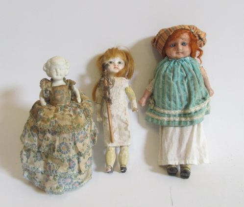 A wax over composition shoulder head doll Image