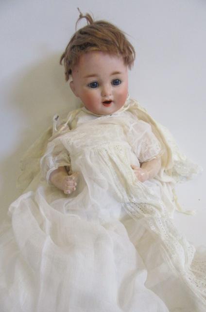 A Schutzmeister & Quendt bisque head doll with blue glass sleeping eyes Image
