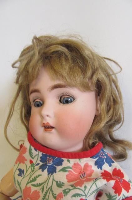 A Kammer & Reinhardt bisque head doll with blue glass sleeping eyes Image