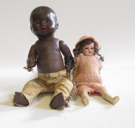 An Armand Marseille bisque head doll with blue glass sleeping eyes Image