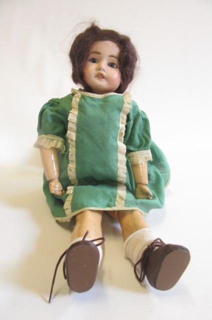 A bisque head doll Image