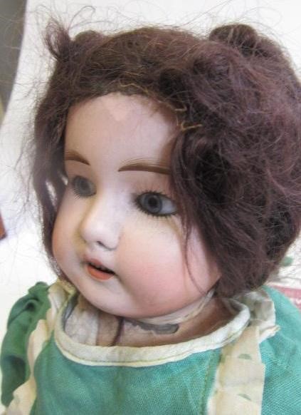 A bisque head doll Image