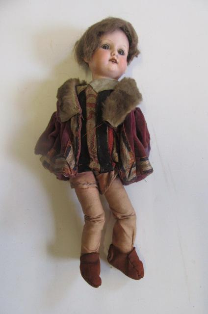 An Armand Marseille bisque head doll with brown glass sleeping eyes Image