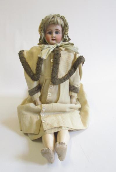 A large Armand Marseille bisque shoulder head doll with blue glass sleeping eyes Image