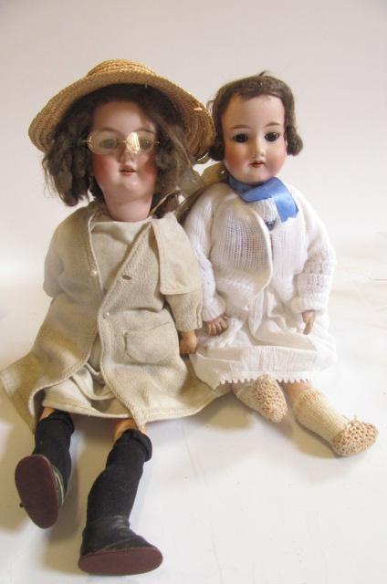 An Armand Marseille bisque head doll with brown glass eyes Image