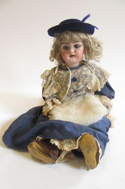 A Simon & Halbig bisque head doll with brown glass sleeping eyes Image