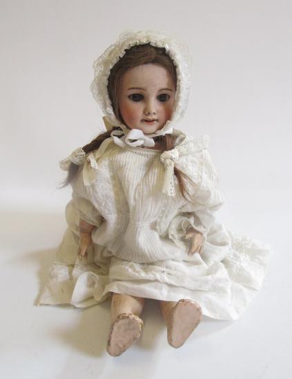 An S.F.B.J. bisque head doll with brown glass sleeping eyes Image