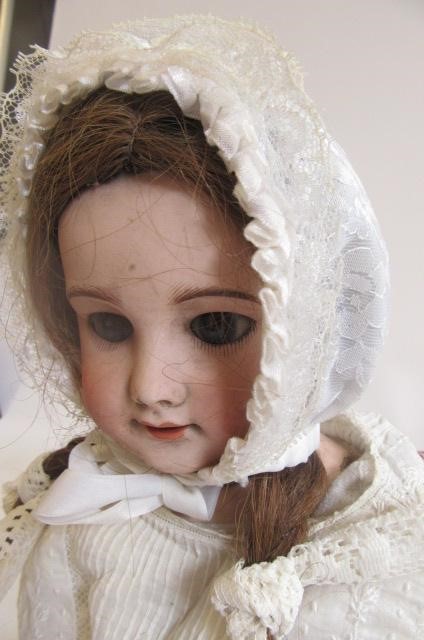 An S.F.B.J. bisque head doll with brown glass sleeping eyes Image