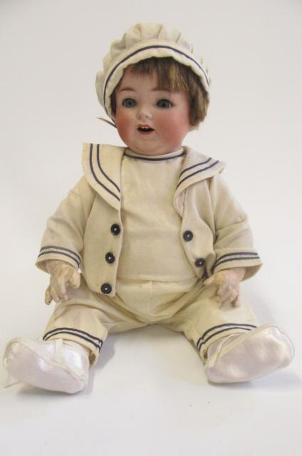 An Ernst Heubach bisque head character boy doll with blue glass sleeping eyes Image