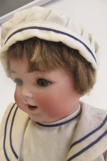 An Ernst Heubach bisque head character boy doll with blue glass sleeping eyes Image