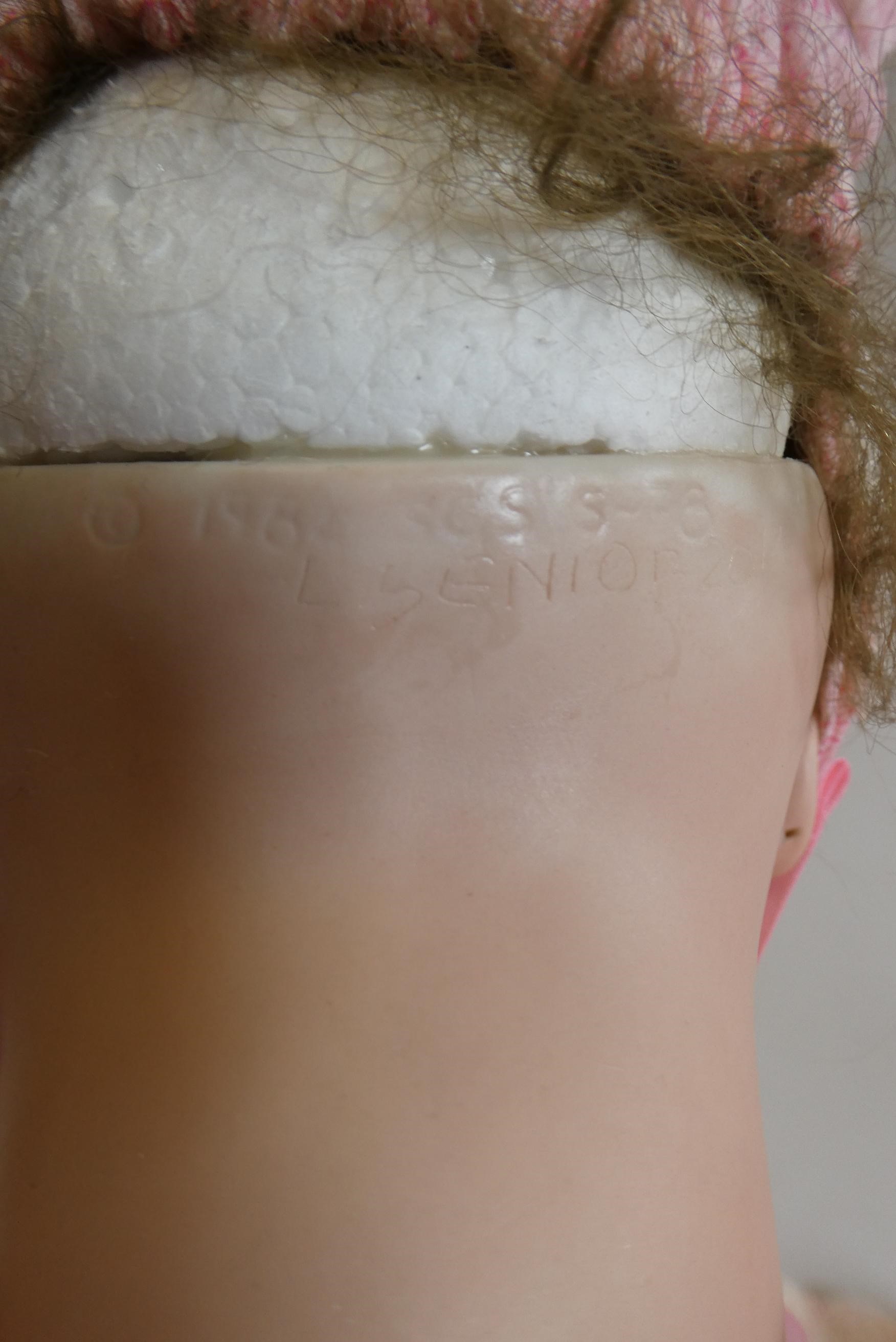 A reproduction "Jumeau" bisque socket head doll with blue glass fixed eyes Image