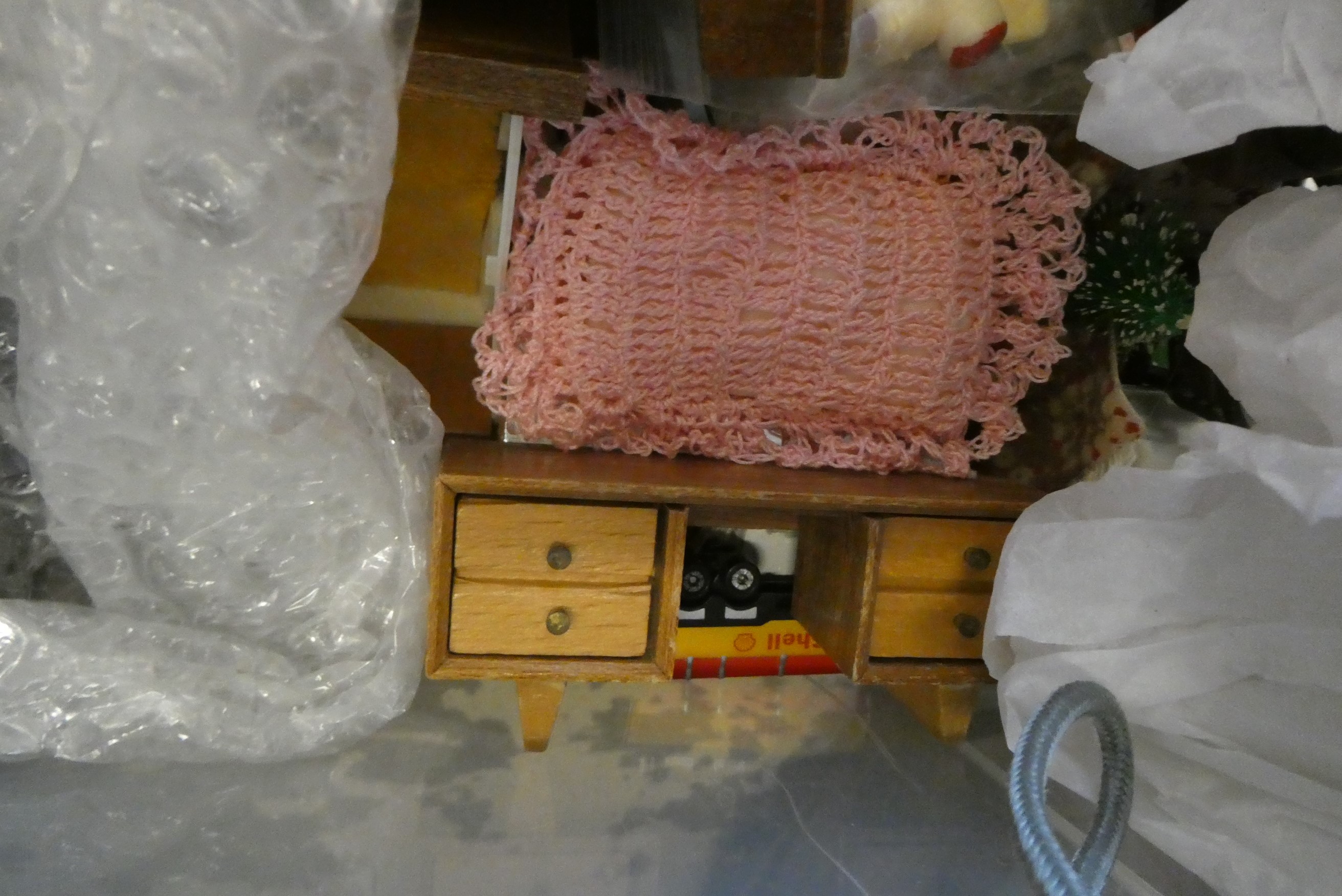Four small boxes of doll's house furniture and accessories, including vintage wooden, metal and Image