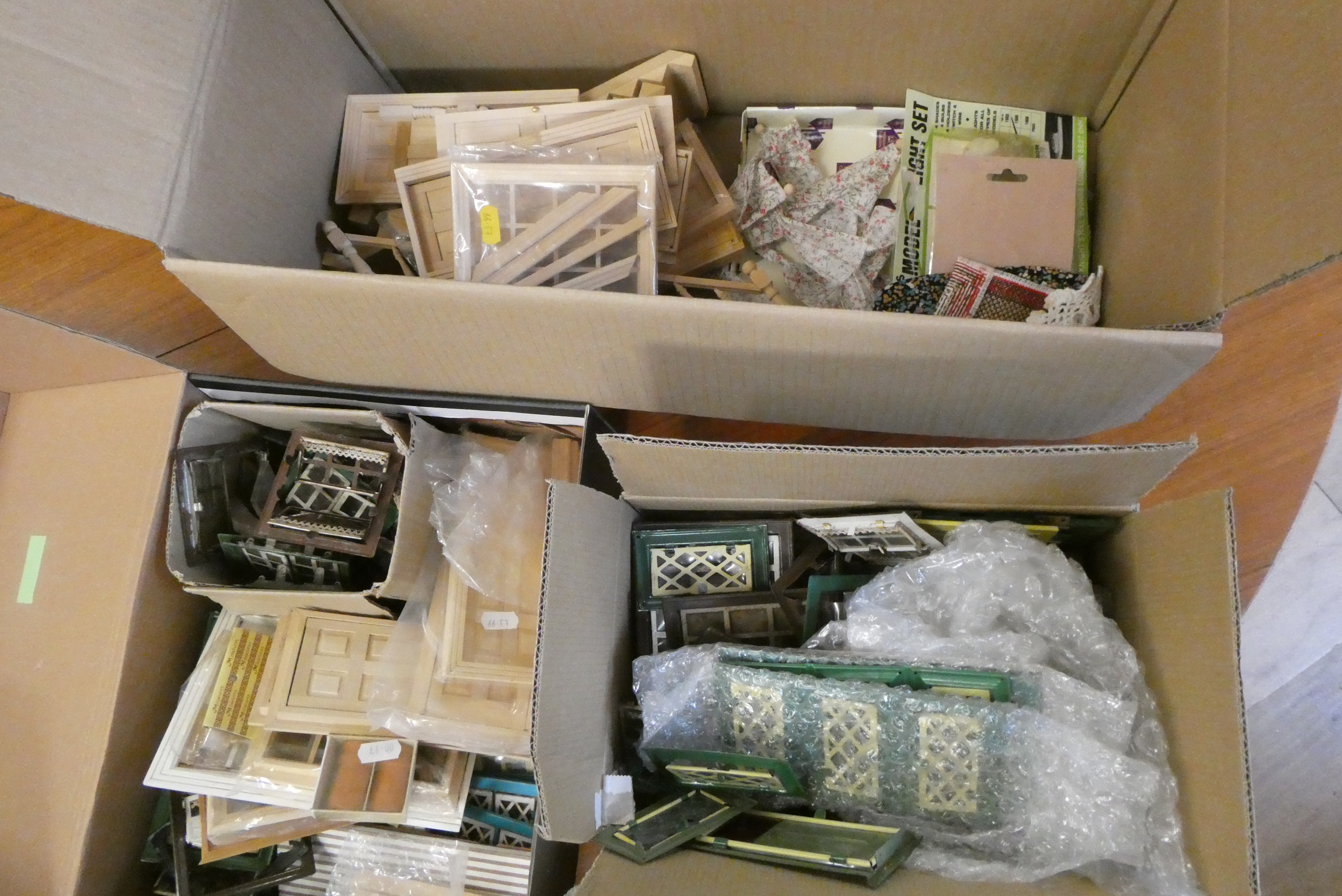 Three boxes of doll's house building items, including vintage metal windows and doors, modern wooden Image