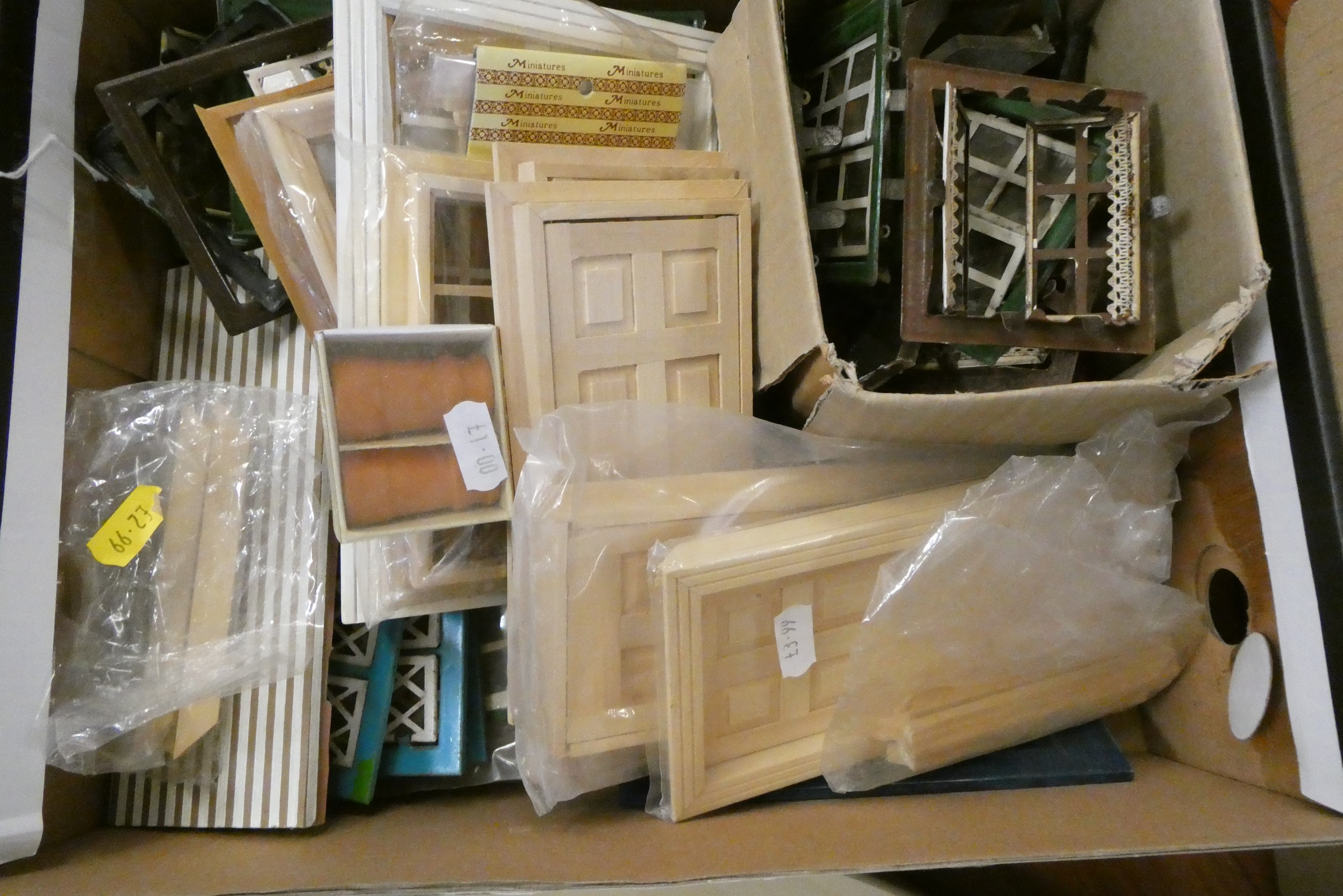 Three boxes of doll's house building items, including vintage metal windows and doors, modern wooden Image