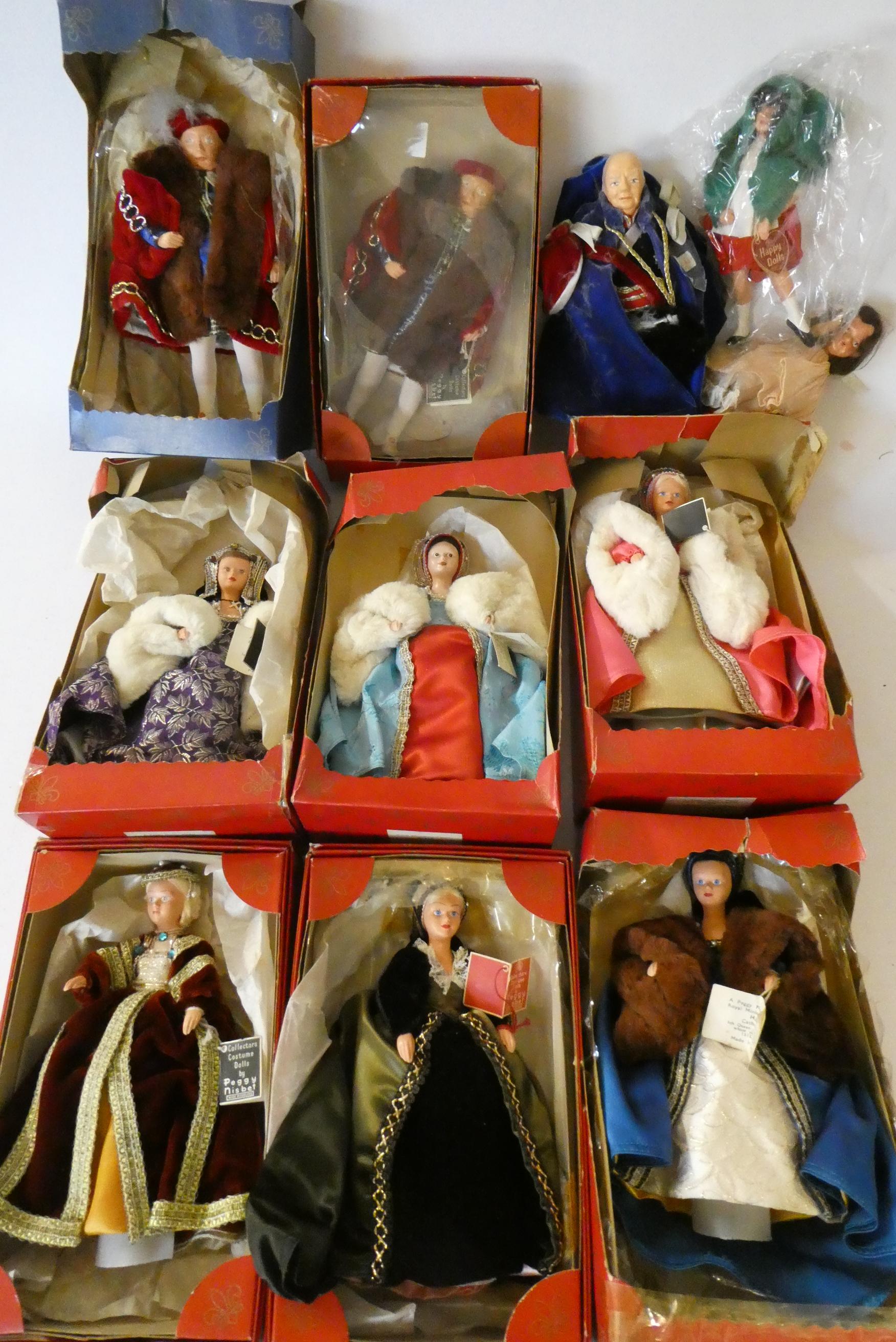 Nine Peggy Nisbet dolls comprising two Henry the VIII dolls, his six wives, and Churchill, together Image