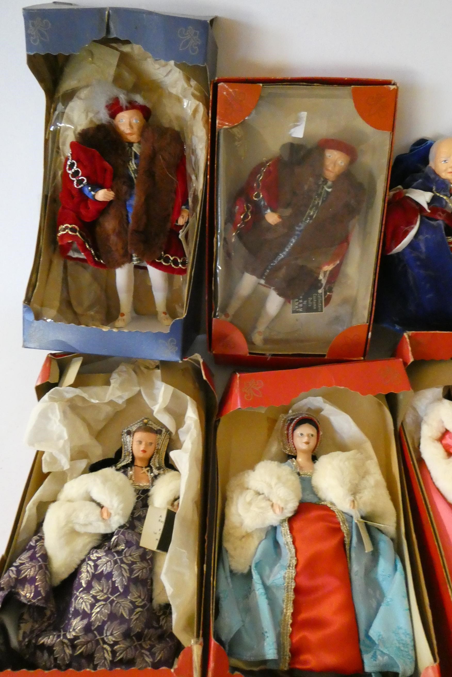 Nine Peggy Nisbet dolls comprising two Henry the VIII dolls, his six wives, and Churchill, together Image