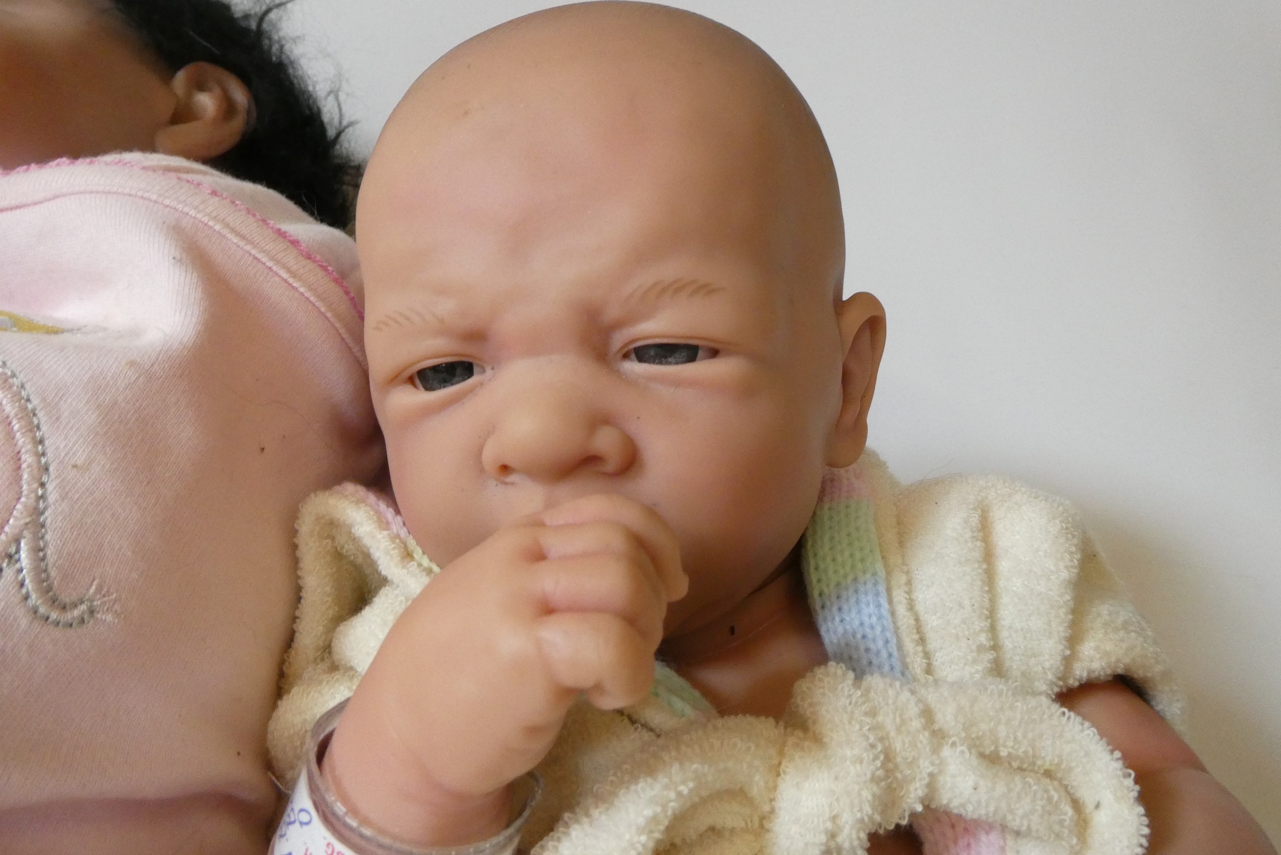 Three reborn type vinyl dolls, comprising Berenguer, Gustav Adolf Dietz and another (Est. plus 24% Image