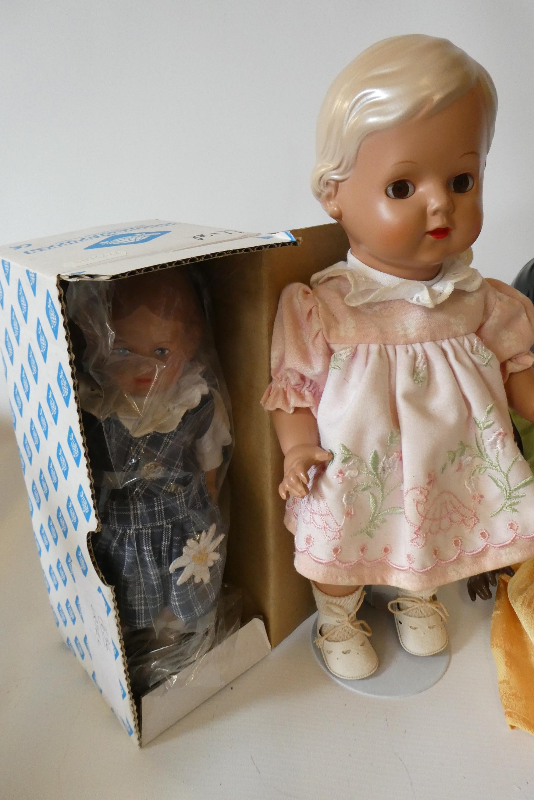 Five Schildkrot-Puppen jointed celluloid dolls, with moulded hair and original outfits, one boxed Image