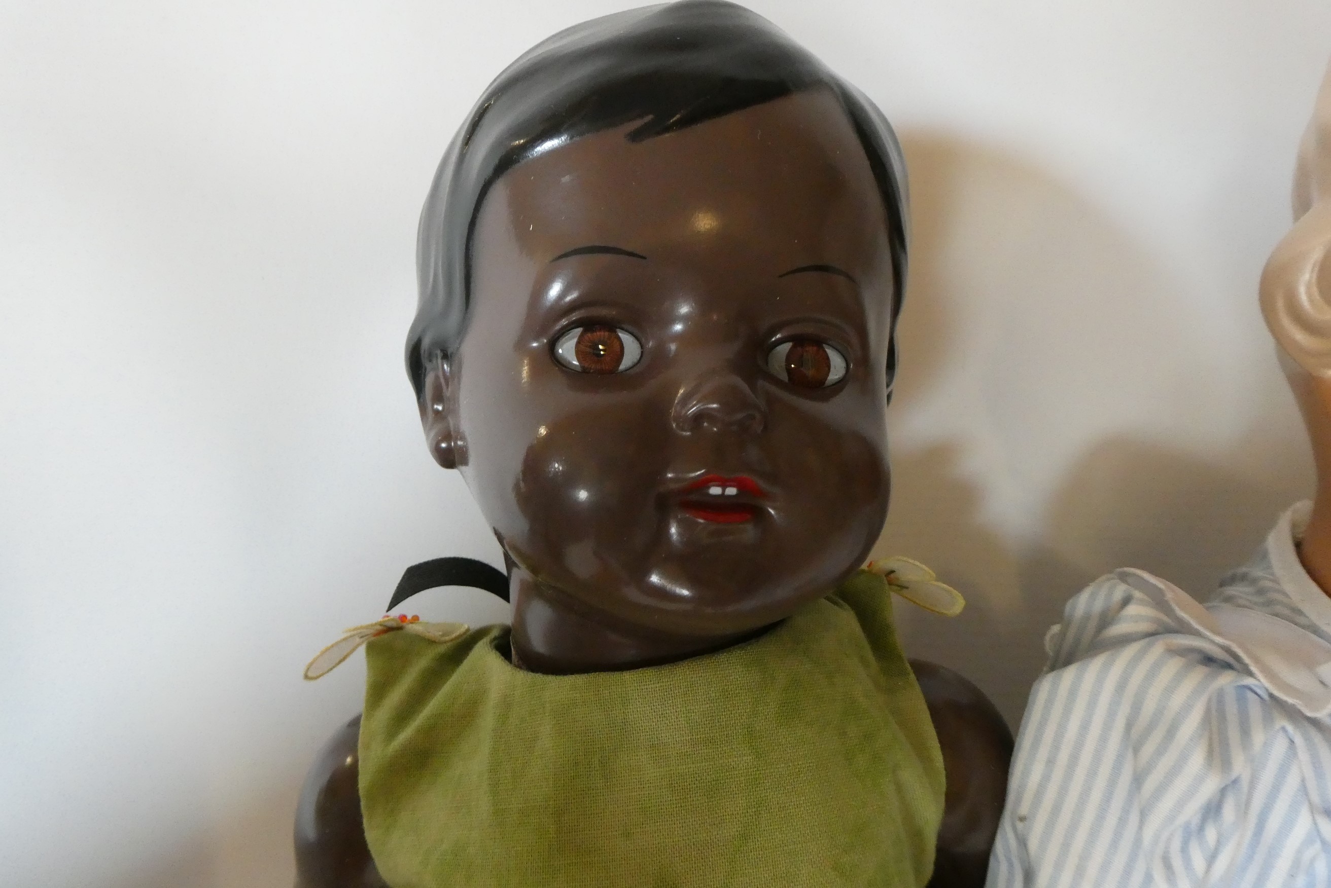 Five Schildkrot-Puppen jointed celluloid dolls, with moulded hair and original outfits, one boxed Image