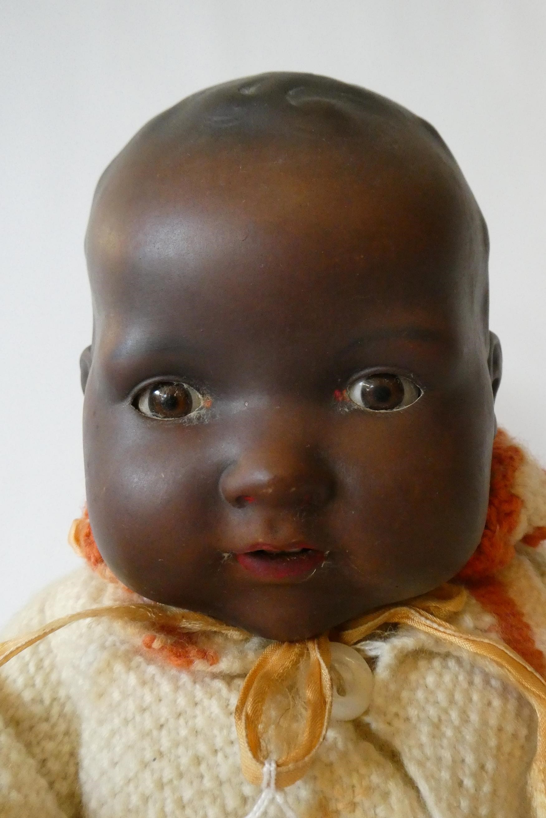 An Armand Marseille bisque socket head baby doll Image