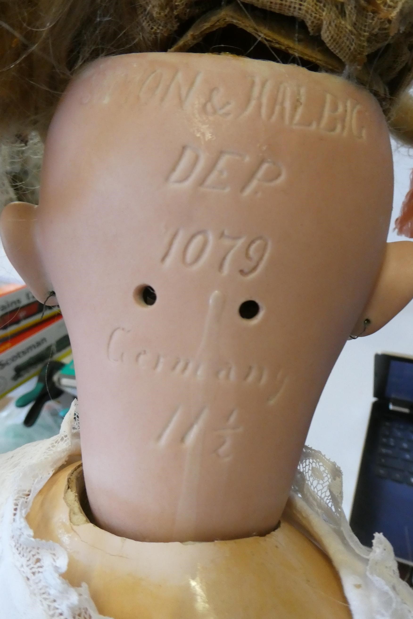 A Simon & Halbig bisque socket head doll Image