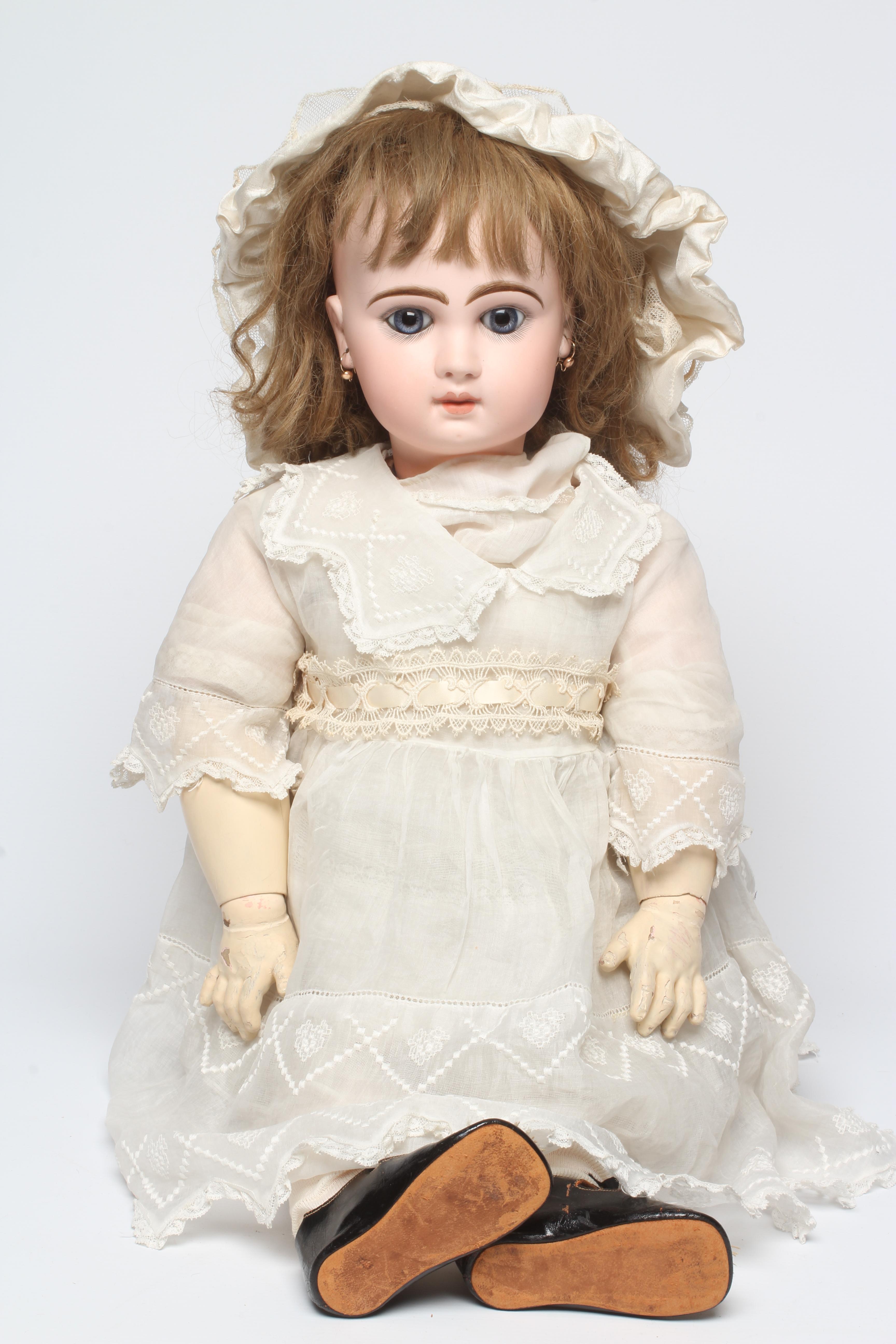 A Bebe Jumeau bisque socket head doll Image
