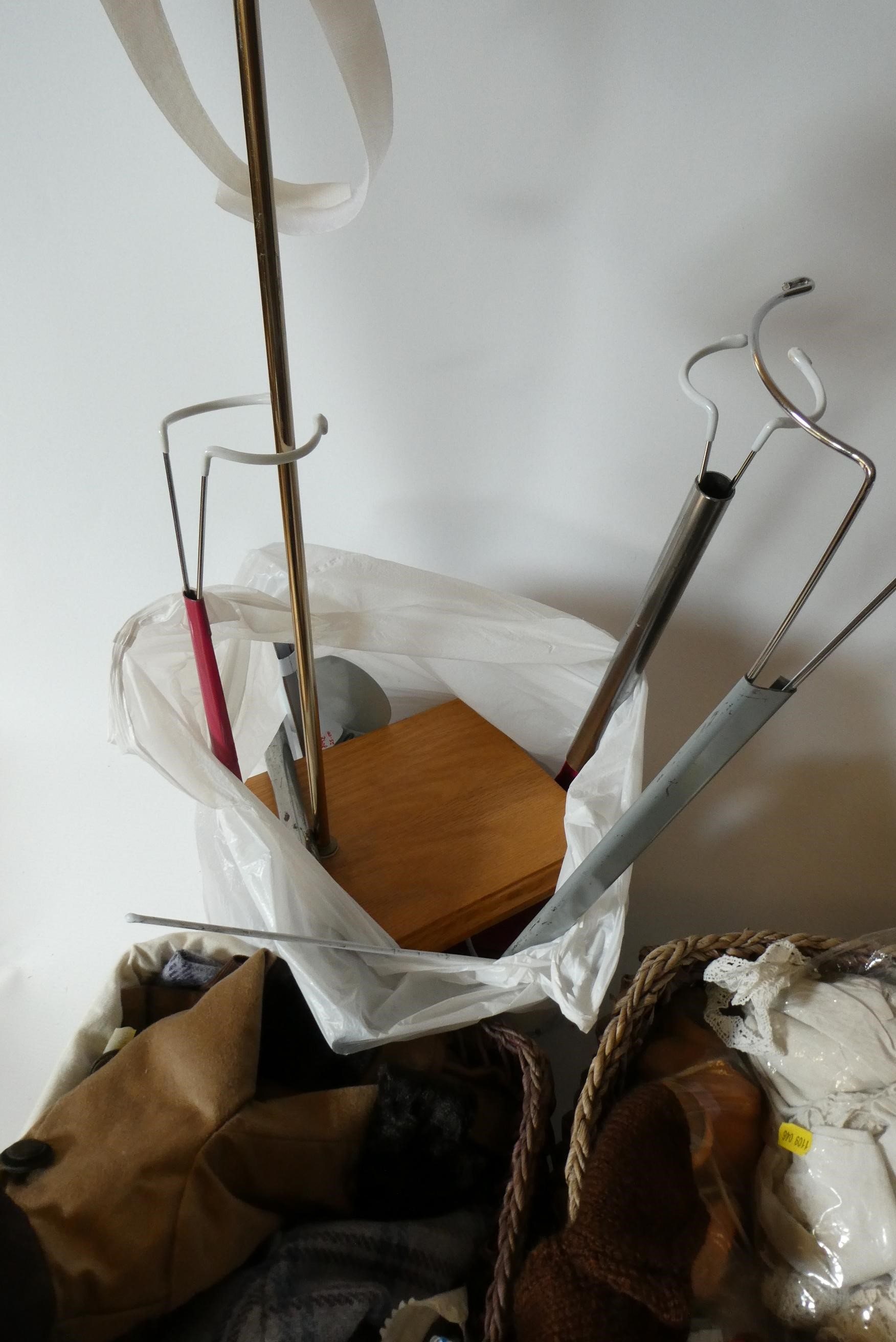 Two baskets of dolls clothing, spare parts and doll stands (Est. plus 24% premium inc. VAT) Image