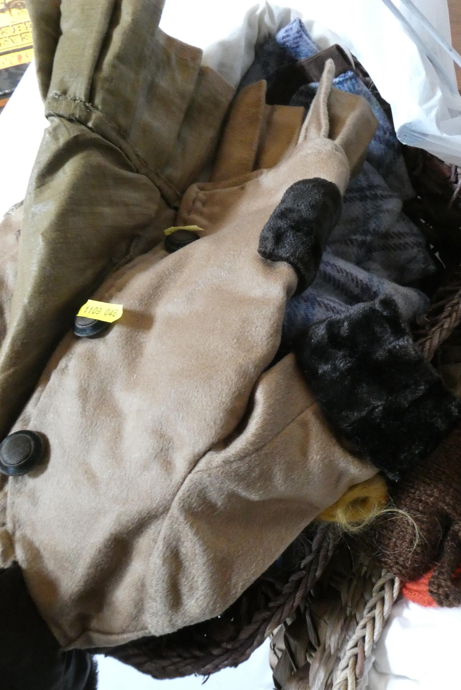 Two baskets of dolls clothing, spare parts and doll stands (Est. plus 24% premium inc. VAT) Image